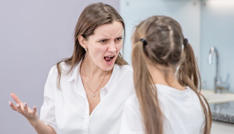Angry mom scolds her teen daughter at home
