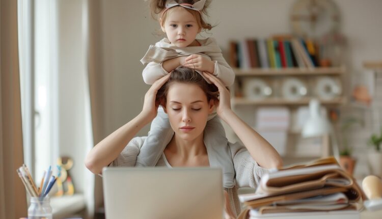 woman-with-baby-her-head-is-holding-laptop