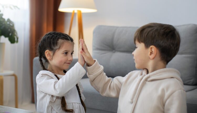 side-view-kids-high-five